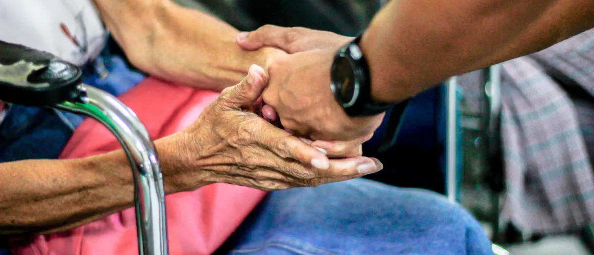 Young hands holding older hands