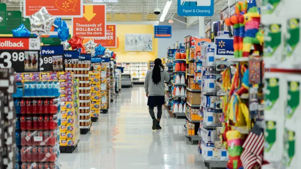 A person walking through the grocery store