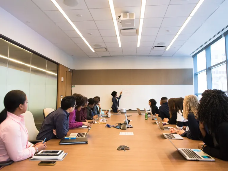 A group looking to the leader of a discussion.
